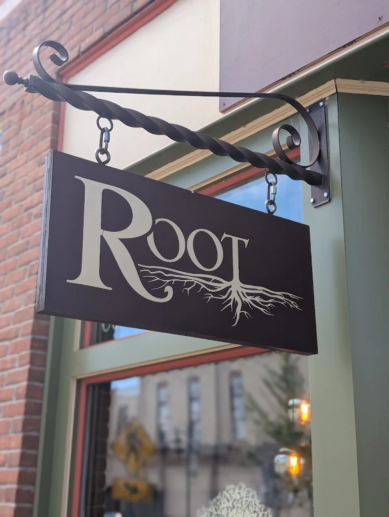 Root Cafe hanging sign on Main Street, Fennville Michigan